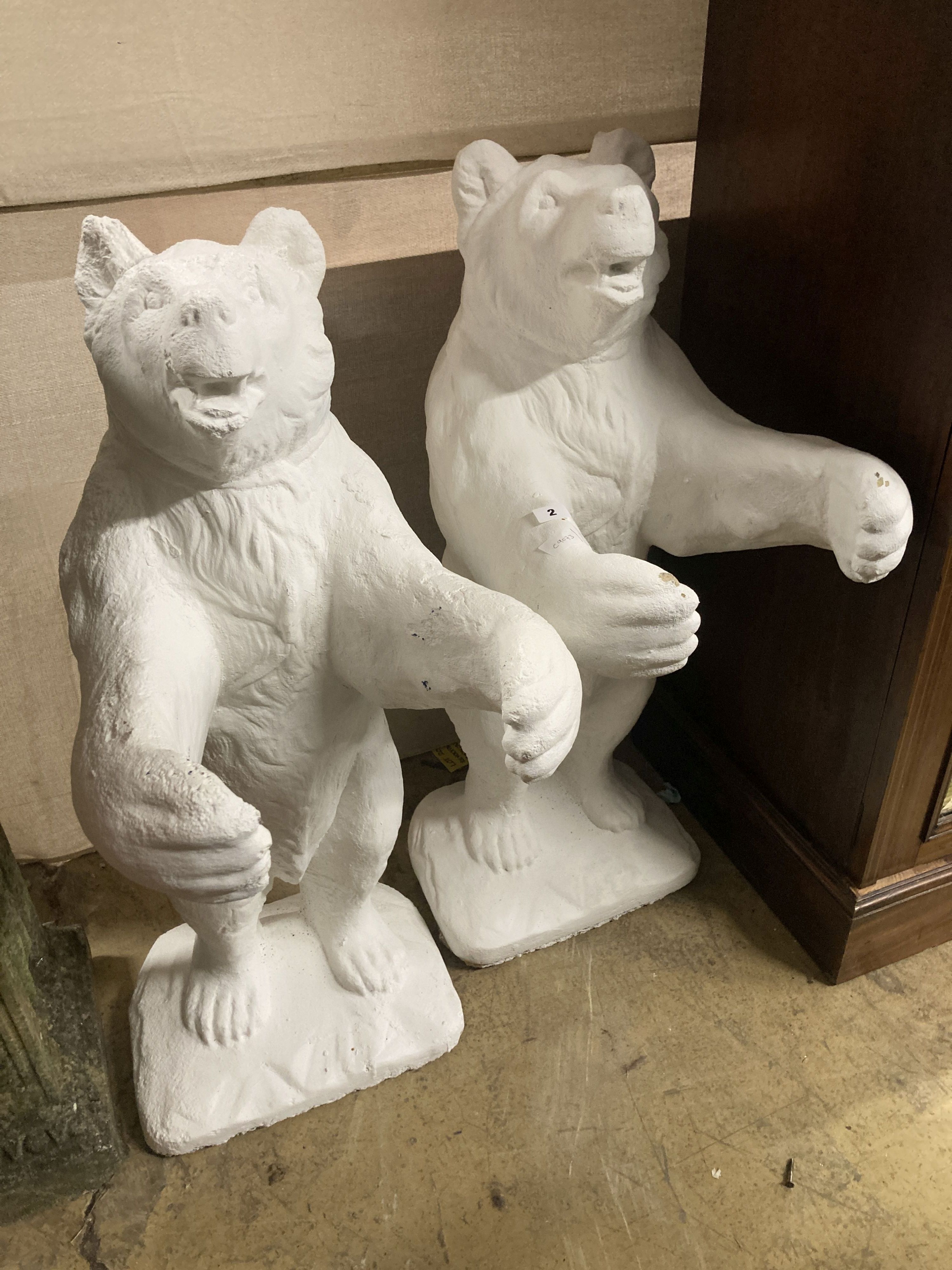 A pair of painted bear reconstituted stone garden pot holders, 97cm high